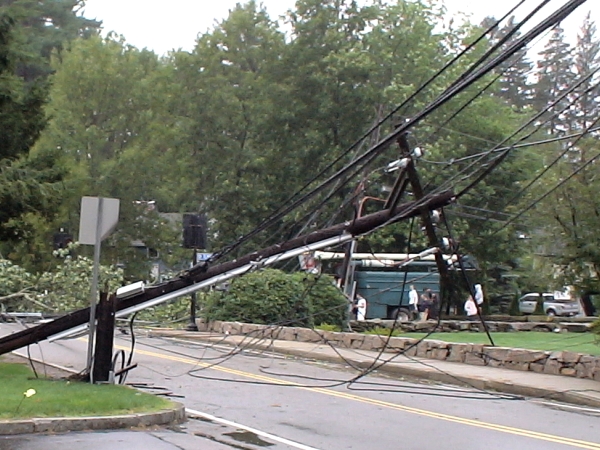 Photo - Close up of one of the phone poles on Salem End Road in Framingham, (near Temple Street), which were taken down by a tree blow over by Hurricane Irene, (August 28, 2011)