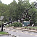 Photo - Close up of one of the phone poles on Salem End Road in Framingham, (near Temple Street), which were taken down by a tree blow over by Hurricane Irene, (August 28, 2011)
