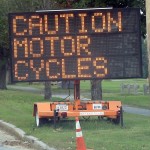 Motor cycle caution sign near road construction in Framingham, MA