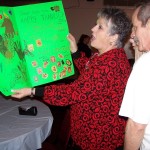Karen & Mark Curtis looking over a ''Thank You'' card made by Framingham Girls Scouts.