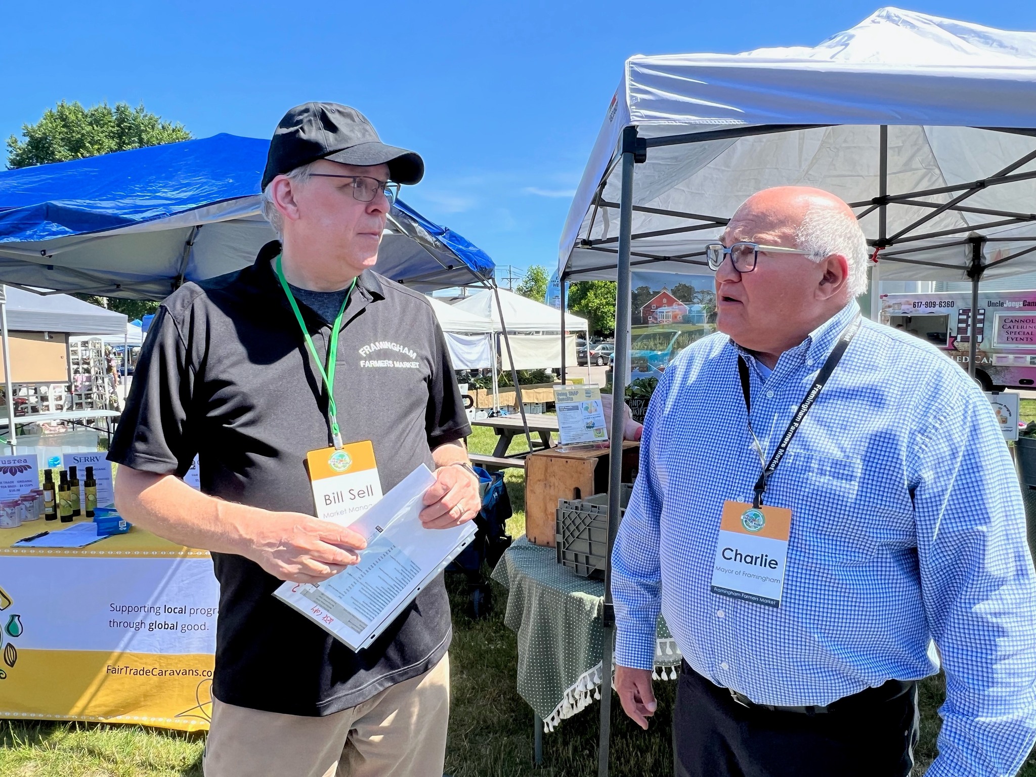 [photo] Framingham Farmer's Market Manager Bill Sell with Mayor Charlie Sisitsky at market on Centre Common. (July 2023)